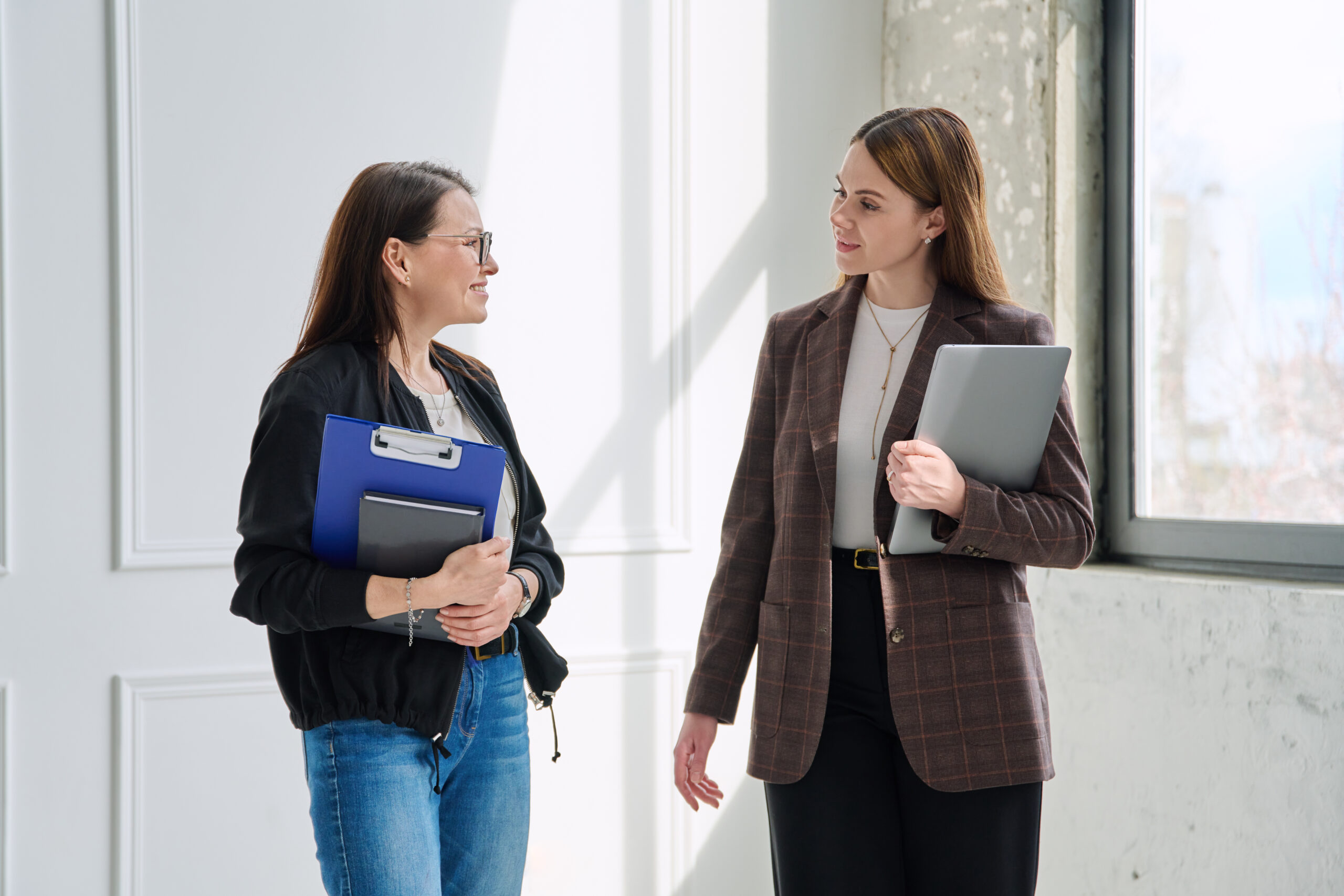 Teacher and Principal talking in Hallway